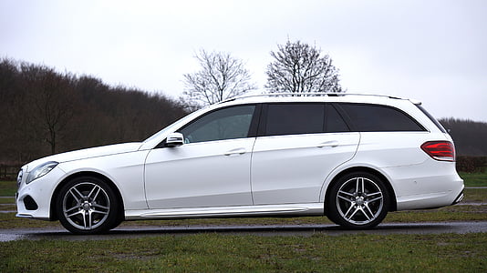 white station wagon on road during daytime thumbnail