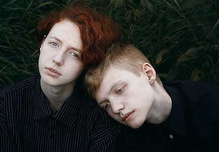 man and woman wearing black collared tops thumbnail