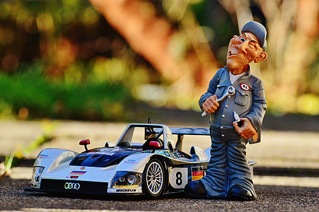 man standing racing car figurine thumbnail