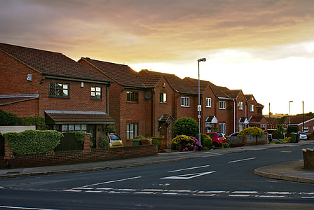 brown houses near road and post thumbnail