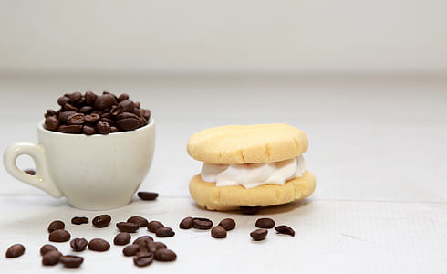 cup filled of coffee beans and macaron thumbnail