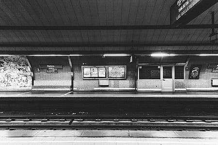 grayscale photography of train station thumbnail