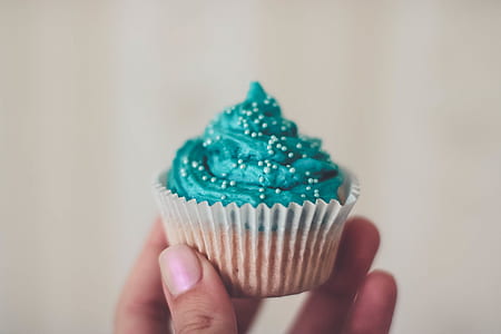 Cupcake With Teal Icing and Sprinkles thumbnail