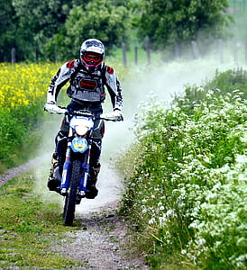 man riding motocross dirt bike thumbnail