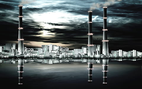 three black towers near body of water thumbnail