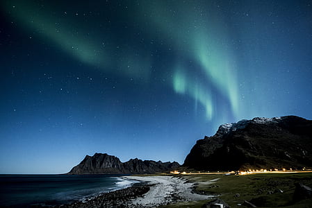 Aurora Borealis over mountain thumbnail