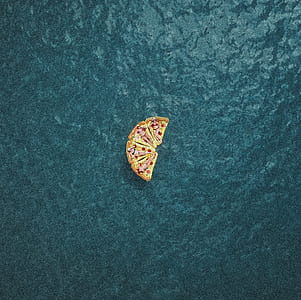 pizza toy on teal surface thumbnail