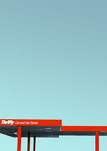 red Trinity car and van rental station during daytime thumbnail