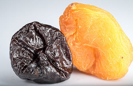 two orange and black dried fruits thumbnail