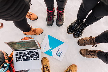 six person forming circle standing on concrete surface thumbnail