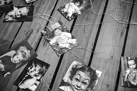 grayscale photos of babies on wooden surface thumbnail