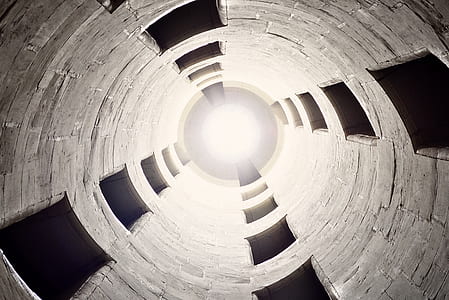 low angle photo of brown tubular tower thumbnail