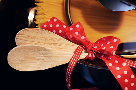 two brown wooden spoons on board thumbnail