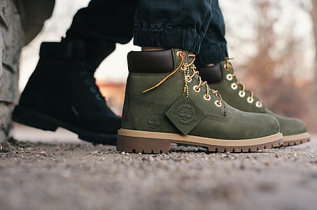 closeup photography of pair of green Timberland work boots thumbnail