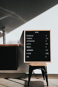 brown wooden framed menu indicated with price thumbnail