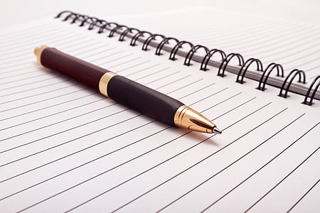 brown ballpoint pen on white paper thumbnail