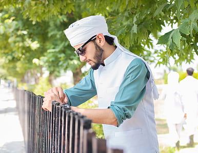 man holding brown fence thumbnail