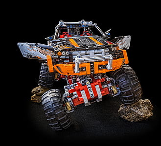 orange and multicolored monster truck thumbnail