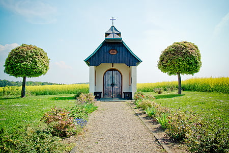 blue and white wooden church photo during daytime thumbnail