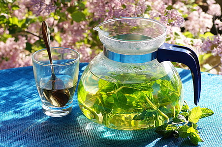 clear glass pitcher on blue table cloth thumbnail
