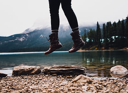 person jumping near body of water thumbnail