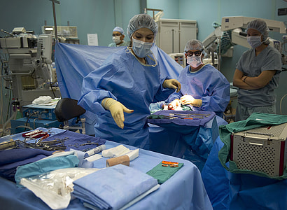 Doctors operating on a patient in the operating room thumbnail