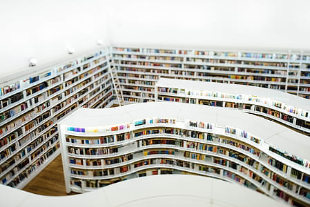 white book shelf with books thumbnail