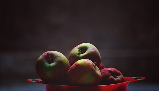 Green and Red Apple Fruits in Red Plastic Bowl thumbnail