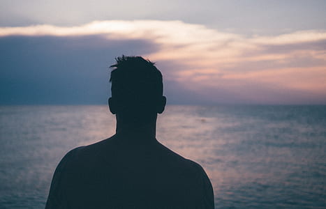 silhouette photo of man during sunset thumbnail