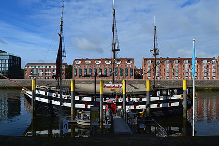 sailing ship dock in front buildings thumbnail