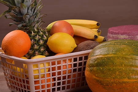 assorted fruits in white plastic basket beside squash thumbnail