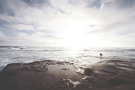 person standing in seashore at daytime thumbnail