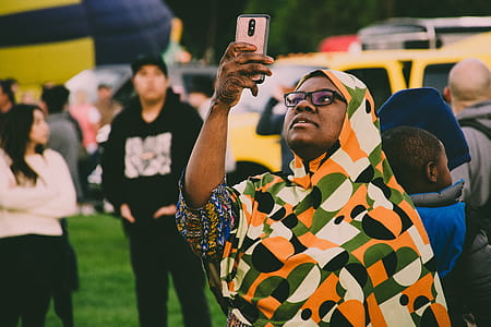 Woman Holding Gold Smartphone thumbnail