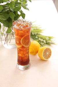 clear drinking glass filled with brown substance thumbnail