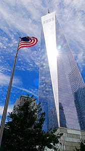 One World Trade Center and american flag. thumbnail