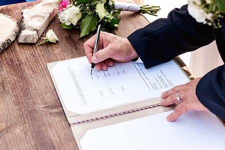 Wedding ceremony. Wedding couple leaving their signatures thumbnail