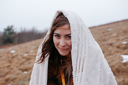 woman covering her head with textile thumbnail