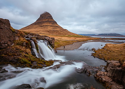brown mountain with river flowing thumbnail
