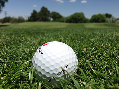 golf ball on green grass field thumbnail