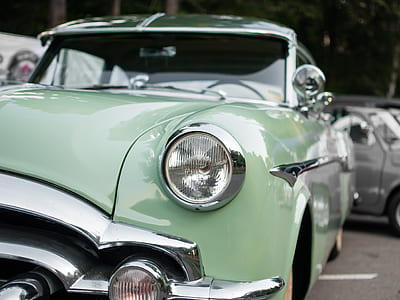 selective focus photography of classic teal vehicle thumbnail