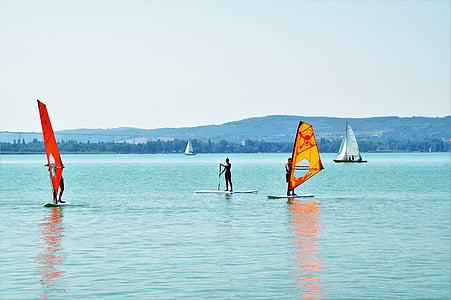 person riding on sail boat thumbnail