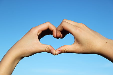 person doing hart hand sign thumbnail