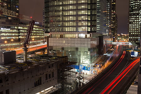 time lapse photography of city with high-rise buildings at night time thumbnail