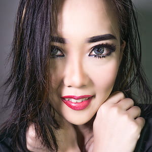 woman wearing red lipstick and black eyeliner thumbnail