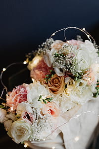 Bouquet of flowers in a bag with some fairy lights thumbnail