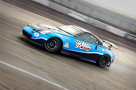 photo of blue Nissan coupe on road thumbnail