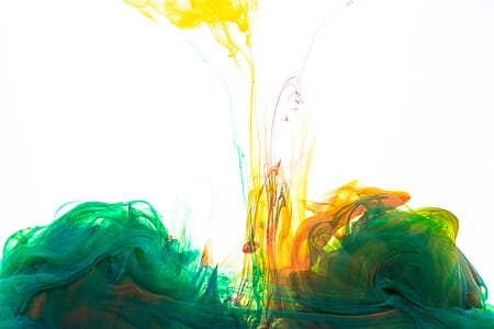 Green Ink With Yellow And Orange Drop Photo thumbnail