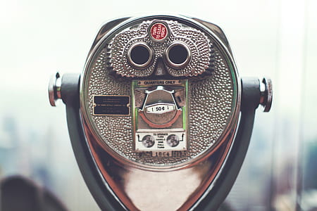 selective focus photography of coin-slot binocular thumbnail