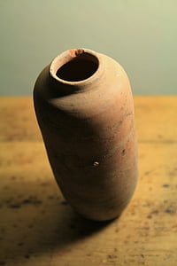 brown ceramic vase on table thumbnail