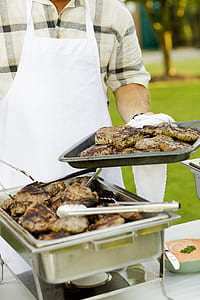 Person Holding Stainless Steel Tray thumbnail